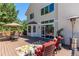 This back deck features an outdoor seating area and ample space for relaxing and entertaining at 10707 Jordan Ct, Parker, CO 80134