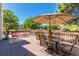 This back deck has an outdoor dining area and additional seating with views of the spacious yard at 10707 Jordan Ct, Parker, CO 80134