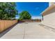 Spacious backyard area with a concrete slab perfect for outdoor activities and recreation at 10707 Jordan Ct, Parker, CO 80134