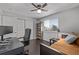 Bedroom features a twin bed, desk, built-in shelving, wood floors and closet at 10707 Jordan Ct, Parker, CO 80134