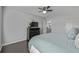 Bedroom featuring a large bed, ceiling fan, hardwood floors and a window for natural light at 10707 Jordan Ct, Parker, CO 80134