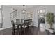 Bright dining room with hardwood floors, modern lighting, and staircase in view at 10707 Jordan Ct, Parker, CO 80134