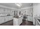 Kitchen with gray cabinetry, stainless steel appliances, and center island at 10707 Jordan Ct, Parker, CO 80134