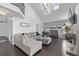 Spacious living room with a vaulted ceiling, skylights, and a comfortable sectional sofa at 10707 Jordan Ct, Parker, CO 80134