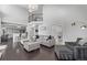 Bright living room with hardwood floors, grey sofa, and second story overlook at 10707 Jordan Ct, Parker, CO 80134