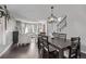 Open-concept living room and dining area with hardwood floors and modern furnishings at 10707 Jordan Ct, Parker, CO 80134