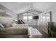 Bright main bedroom featuring vaulted ceilings, a large window, and an adjacent sitting area at 10707 Jordan Ct, Parker, CO 80134