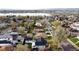 Beautiful aerial view of a neighborhood with mature trees near a serene lake and mountain views at 2728 N Yates St, Denver, CO 80212