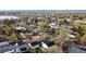 Neighborhood aerial view showing tree-lined streets and diverse homes; a tranquil lakeside community at 2728 N Yates St, Denver, CO 80212