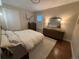 Bright bedroom featuring a comfortable bed, light wood dresser, and a neutral color palette at 2728 N Yates St, Denver, CO 80212
