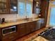 Gourmet kitchen with granite countertops, stainless steel appliances, and a stylish tile backsplash at 2728 N Yates St, Denver, CO 80212