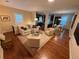 Bright and airy living room featuring hardwood floors, neutral tones, and open layout, perfect for gatherings at 2728 N Yates St, Denver, CO 80212