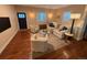 Well-appointed living room with dark hardwood floors and a comfortable seating arrangement at 2728 N Yates St, Denver, CO 80212