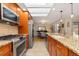 Updated kitchen with stainless steel appliances and granite counters at 4707 Harrison Ave, Boulder, CO 80303