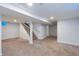 Unfinished basement with carpeted floors and ample storage space at 6825 E Martin Luther King Jr Blvd, Denver, CO 80207