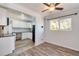 Kitchen and dining area with hardwood floors and white cabinets at 6825 E Martin Luther King Jr Blvd, Denver, CO 80207