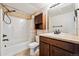 Clean bathroom with shower/tub combo, vanity, and linen cabinet at 1162 Rockhurst Dr # 201, Highlands Ranch, CO 80129