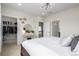 Spacious bedroom featuring a walk-in closet and vanity area with a round mirror at 11027 Sunshimmer Cir, Parker, CO 80134