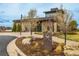 Landscaped view of The Lantern House clubhouse featuring stone and contemporary architecture at 11027 Sunshimmer Cir, Parker, CO 80134