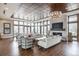 Spacious clubhouse lounge area with modern furnishings, large windows, and stylish lighting at 11027 Sunshimmer Cir, Parker, CO 80134