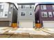 Charming two-story home with a attached two-car garage and lovely gray siding at 11027 Sunshimmer Cir, Parker, CO 80134