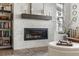 Living room fireplace with custom brick, mirror, and contemporary design at 11027 Sunshimmer Cir, Parker, CO 80134