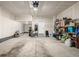 Spacious garage with concrete floor and shelving for storage at 11027 Sunshimmer Cir, Parker, CO 80134
