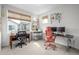 Bright home office with two workspaces and large windows at 11027 Sunshimmer Cir, Parker, CO 80134