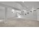 Unfinished basement with carpet flooring, white walls, recessed lights, and display niches at 5927 S Kline St, Littleton, CO 80127