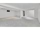 Unfinished basement with carpet flooring, white walls and a small window at 5927 S Kline St, Littleton, CO 80127