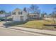 Charming two-story home with a two-car garage, brick accents, well-maintained lawn, and mature trees at 5927 S Kline St, Littleton, CO 80127
