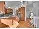 Spacious kitchen features stainless steel appliances, wood cabinets, granite countertops, hardwood floors, and access to the entry at 5927 S Kline St, Littleton, CO 80127