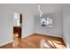 Bright living area features hardwood floors, vaulted ceilings, modern lighting, and an adjacent kitchen at 5927 S Kline St, Littleton, CO 80127