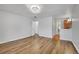 Expansive living space featuring wood floors and multiple entryways at 5927 S Kline St, Littleton, CO 80127
