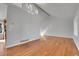 Bright and airy living room featuring vaulted ceilings, hardwood floors, and updated lighting fixtures at 5927 S Kline St, Littleton, CO 80127