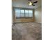 Spacious bedroom with large windows, plush carpeting, and a ceiling fan at 935 N Pennsylvania St # 3, Denver, CO 80203