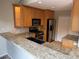 Stylish kitchen with granite countertops and stainless steel appliances at 935 N Pennsylvania St # 3, Denver, CO 80203
