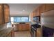 Bright kitchen with granite counters and stainless steel appliances near a window at 935 N Pennsylvania St # 3, Denver, CO 80203