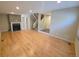Spacious living room with wood flooring, fireplace, staircase and entry to other rooms at 935 N Pennsylvania St # 3, Denver, CO 80203