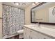 Clean bathroom with shower and floral curtain at 11733 Elk Head Range Rd, Littleton, CO 80127