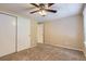 Bedroom with ceiling fan and double closets at 11733 Elk Head Range Rd, Littleton, CO 80127