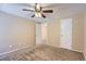 Bedroom with ceiling fan and access to another room at 11733 Elk Head Range Rd, Littleton, CO 80127