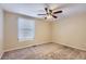 Simple bedroom with window blinds and ceiling fan at 11733 Elk Head Range Rd, Littleton, CO 80127