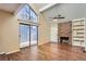 Living room features hardwood floors, fireplace, and sliding glass door to patio at 11733 Elk Head Range Rd, Littleton, CO 80127