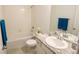 Clean bathroom with bathtub, shower, and granite vanity at 11860 Sandcastle Ct, Parker, CO 80138