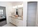 Double vanity bathroom with granite countertop and linen closet at 11860 Sandcastle Ct, Parker, CO 80138