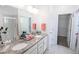 Double vanity bathroom with granite countertop and walk-in shower at 11860 Sandcastle Ct, Parker, CO 80138