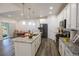 Modern kitchen with granite countertops and stainless steel appliances at 11860 Sandcastle Ct, Parker, CO 80138