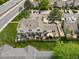 Aerial view of property featuring a well-maintained lawn, fenced backyard, and outdoor seating at 9676 W Chatfield Ave # B, Littleton, CO 80128