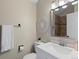 Bright bathroom featuring a white vanity, toilet, and decorative accents at 9676 W Chatfield Ave # B, Littleton, CO 80128